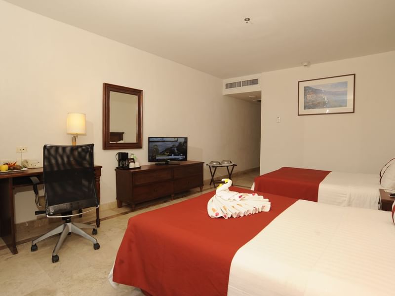 Twin beds with a TV in Standard Double Room at Gamma Hotels