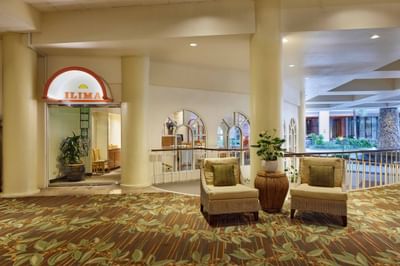 Spacious lounge area & exterior of Ilima Cafe at Waikiki Resort Hotel by Sono