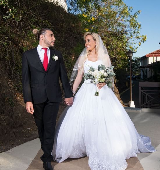 Wedded couple posing outdoors at Villas Sol Beach Resort