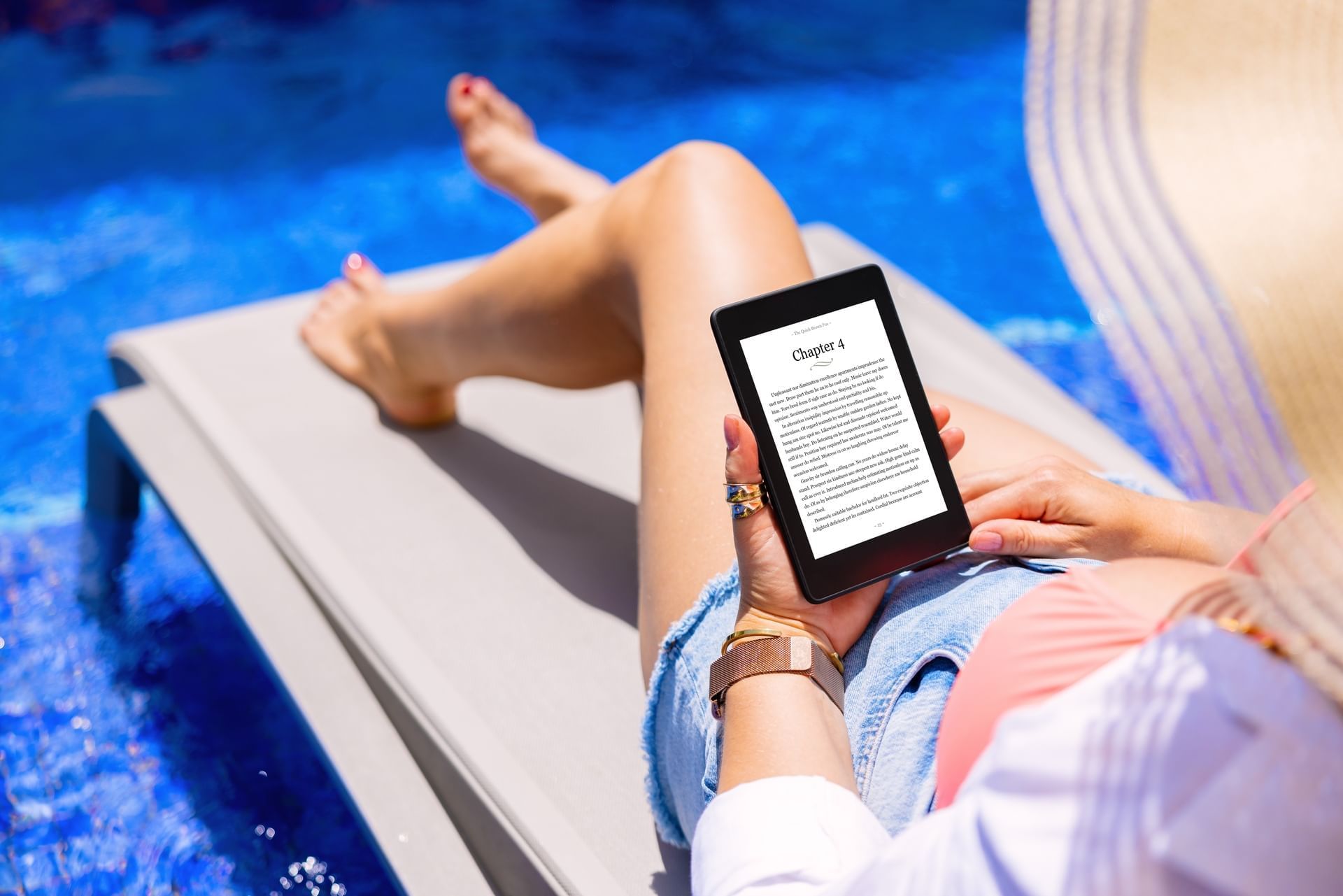 Close-up of lady on a lounger watching phone at Sunset Plaza Beach Resort, Puerto Vallarta Resort