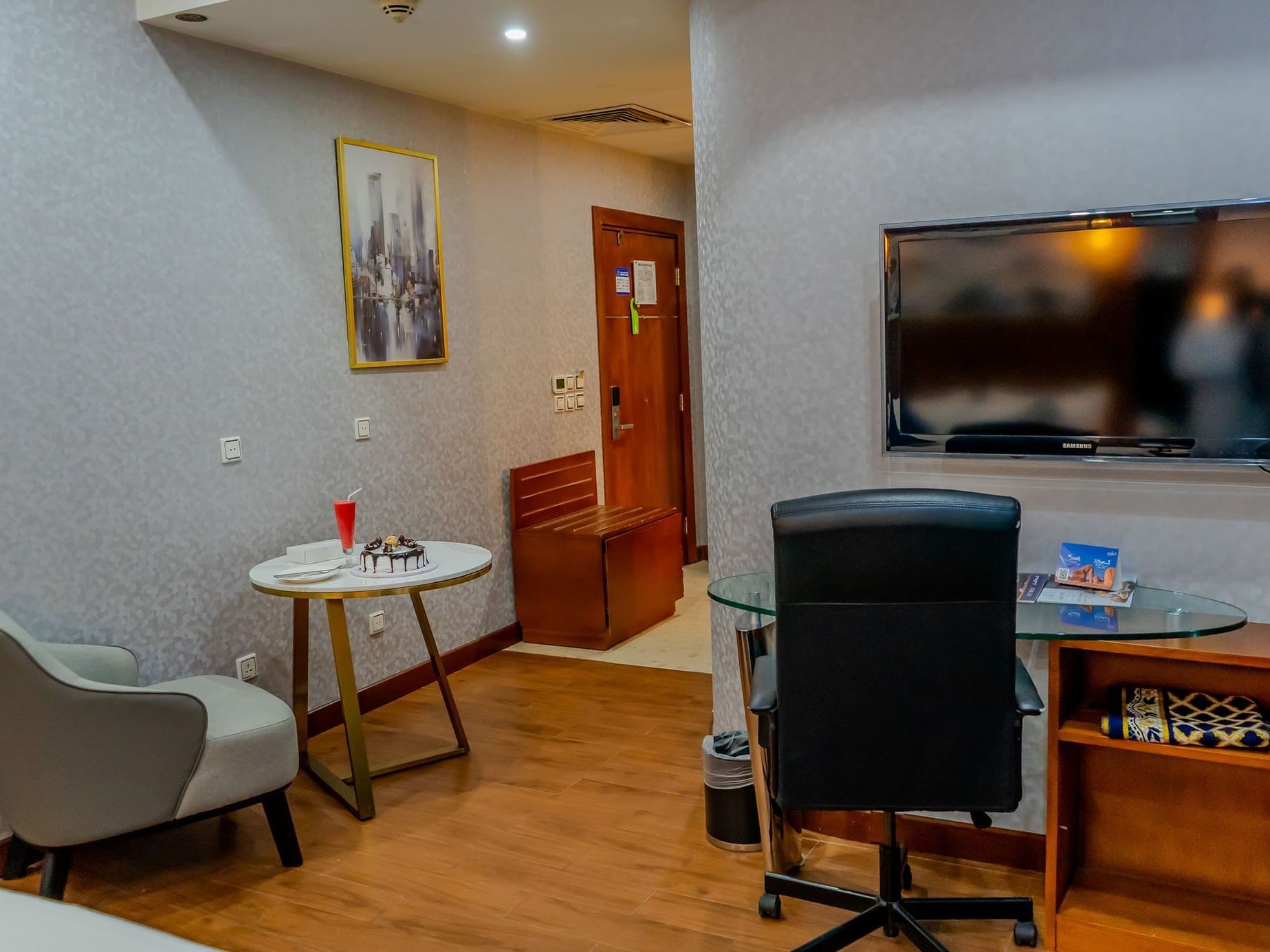 Workspace with seating area in Junior Suite at Dabab Hotel by Warwick - Riyadh