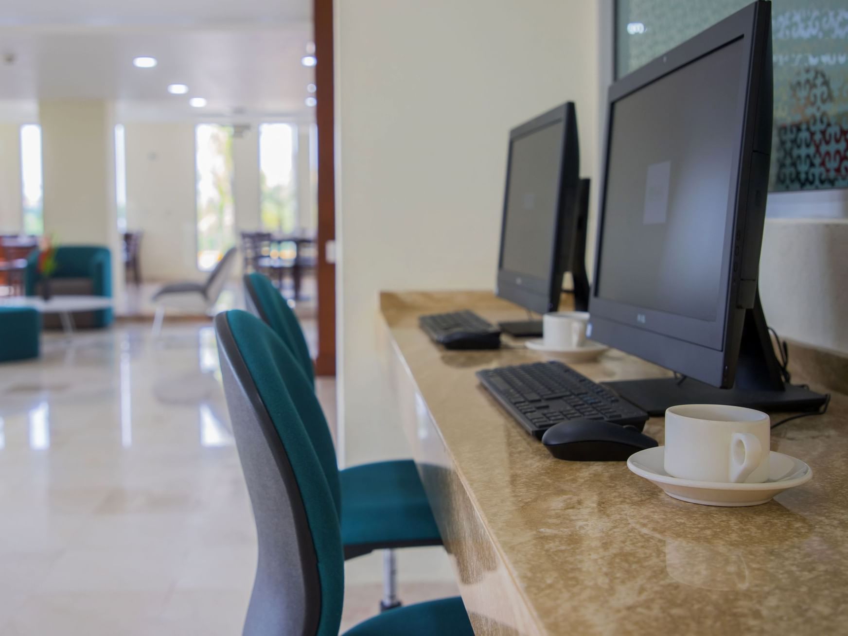 Desktop computers in the Centro De Negocios at Gamma Hotels