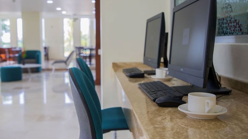 Close-up of computers on the table at Gamma Tampico