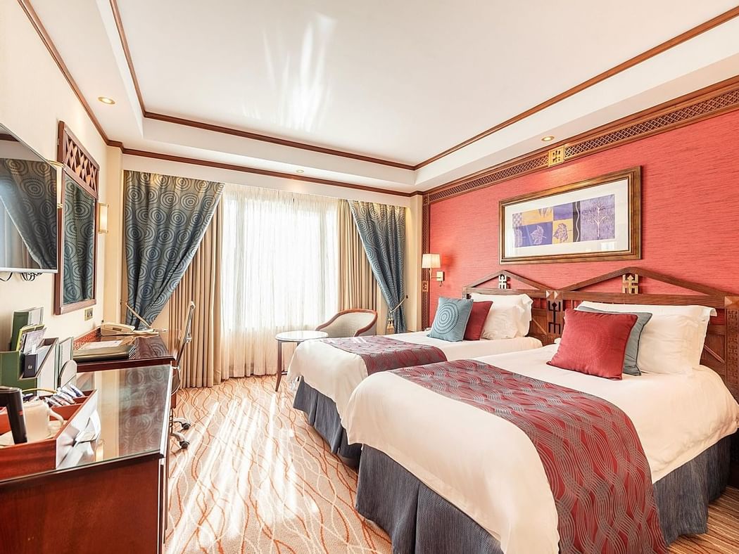Two beds & Tv in Deluxe Room at Nairobi Serena Hotel