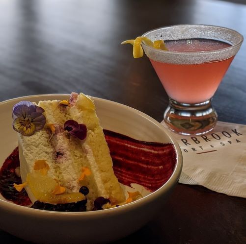 Slice of Lemon Huckleberry Cake and a drink served at Resort