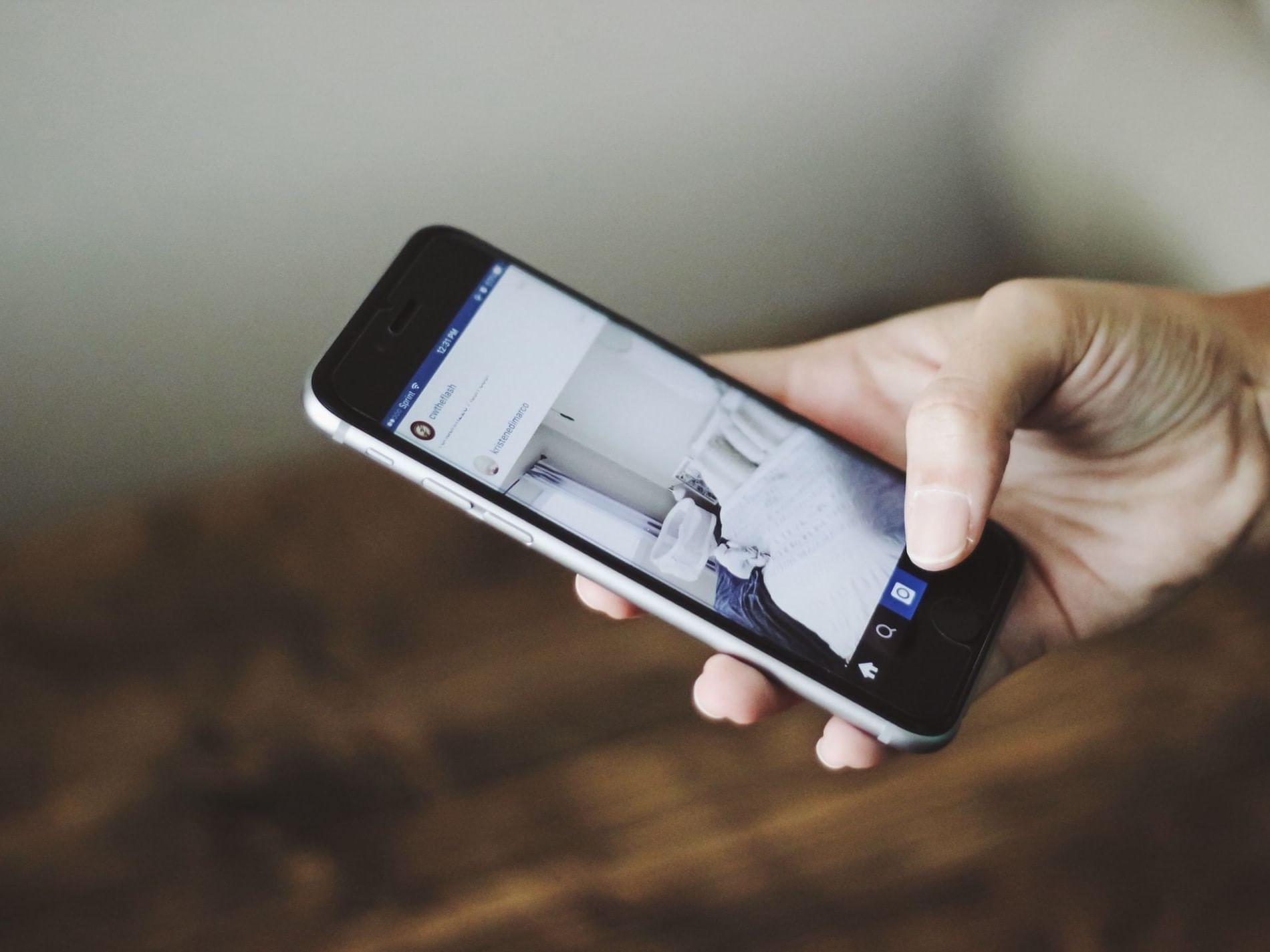 Close-up of a person using a mobile phone at La Galerie Hotel