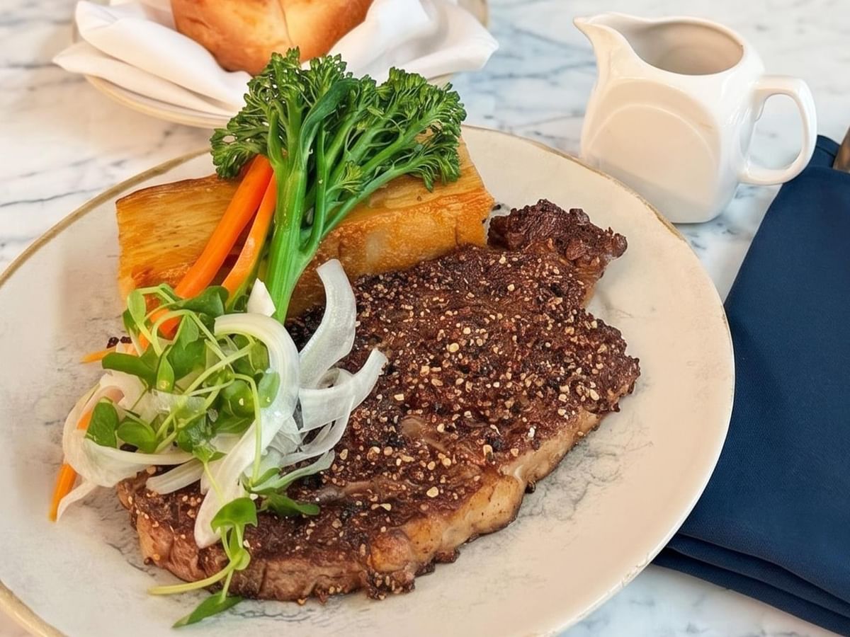 Steak with vegetables and sauce.