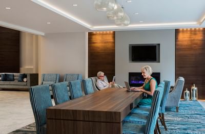 Woman working on her laptop in a meeting room at Temple Gardens Hotel & Spa
