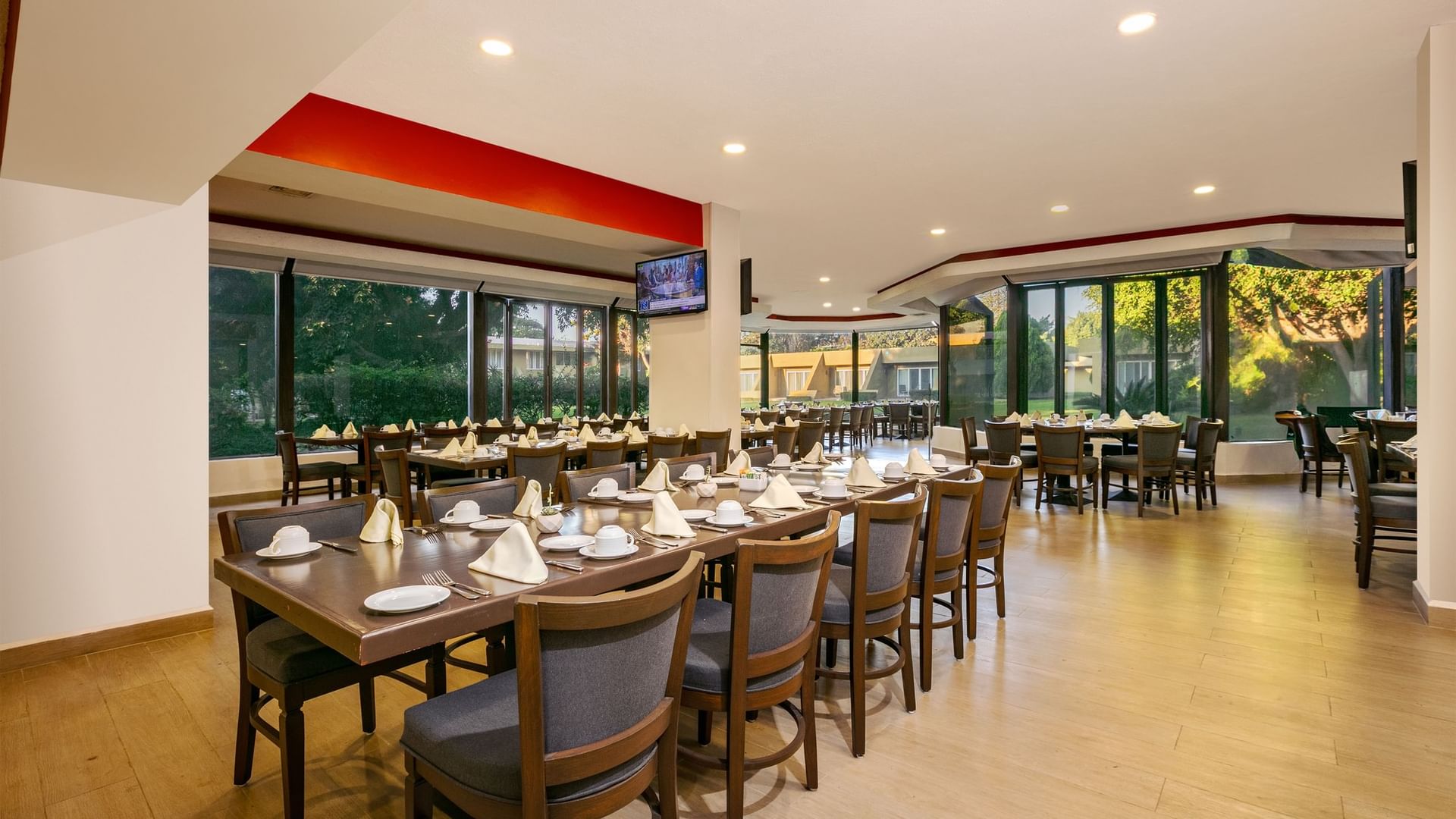 Interior of La Huerta restaurant with set tables at Camino Real Guadalajara in Zapopan