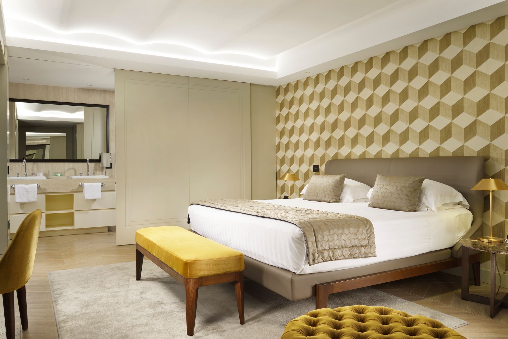 Cozy bed with seating arranged in Margutta Suite at Margutta 54