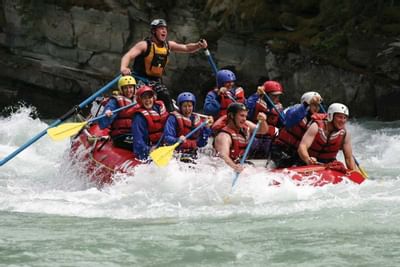 People Rafting on a river in Jasper National Park of Canada near Blackstone Mountain Lodge
