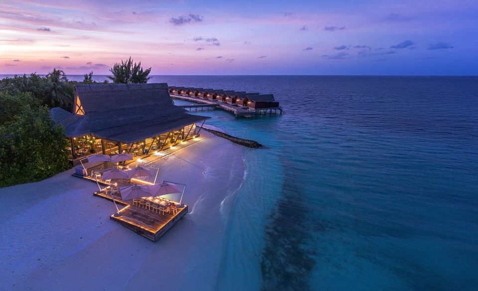 Aerial view of Edge restaurant and dining area at sunset at Grand Park Kodhipparu.