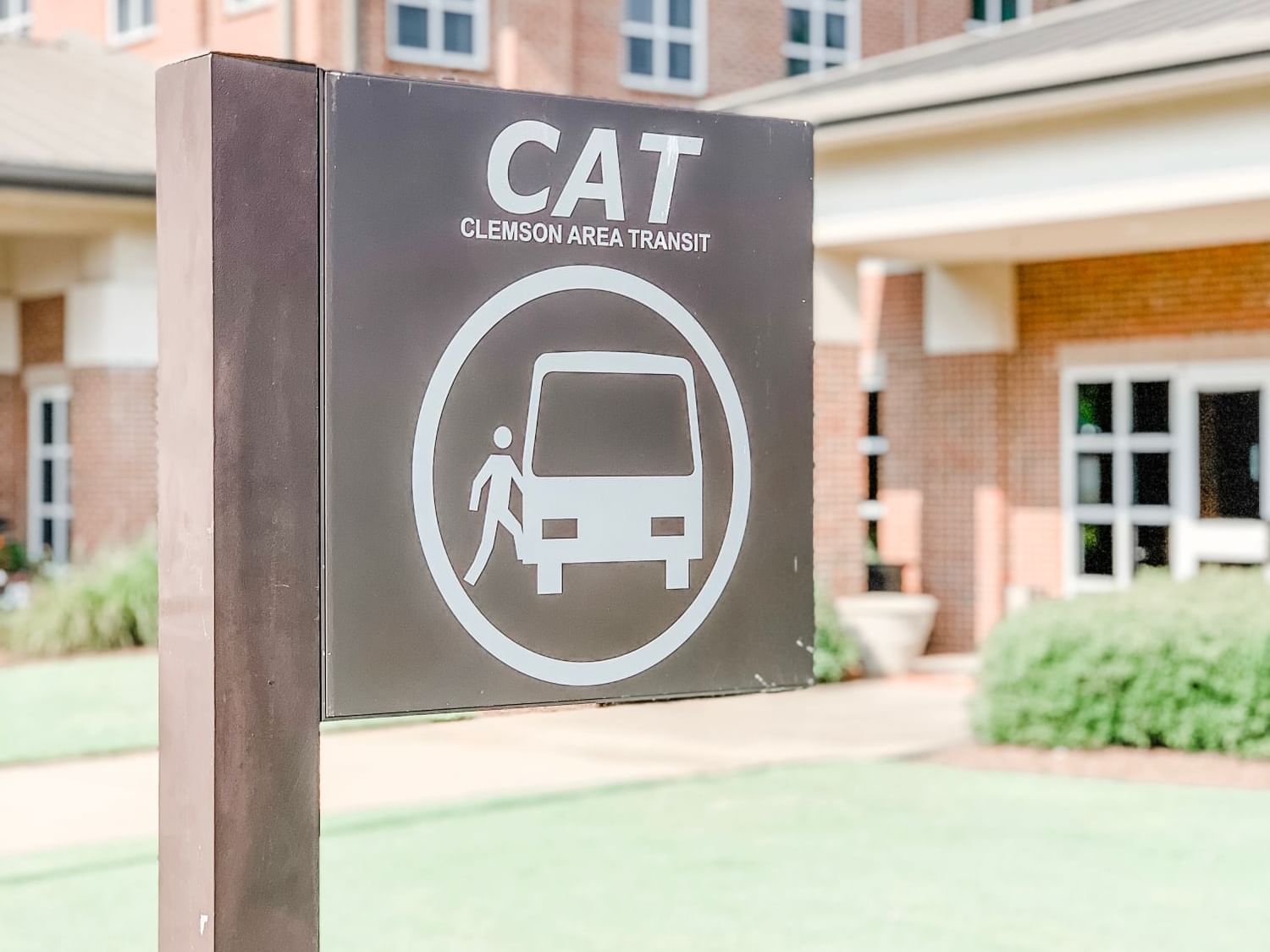 CATbus sign to show Stop in front of hotel building