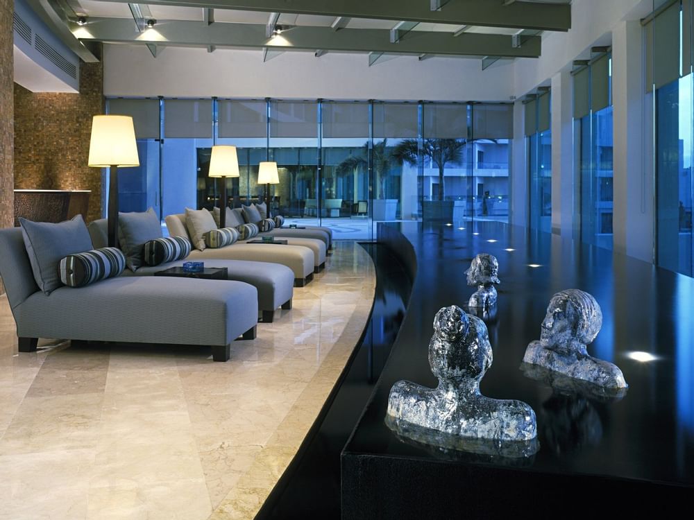 Lobby with sofas, glass doors at Live Aqua Beach Resort Cancun