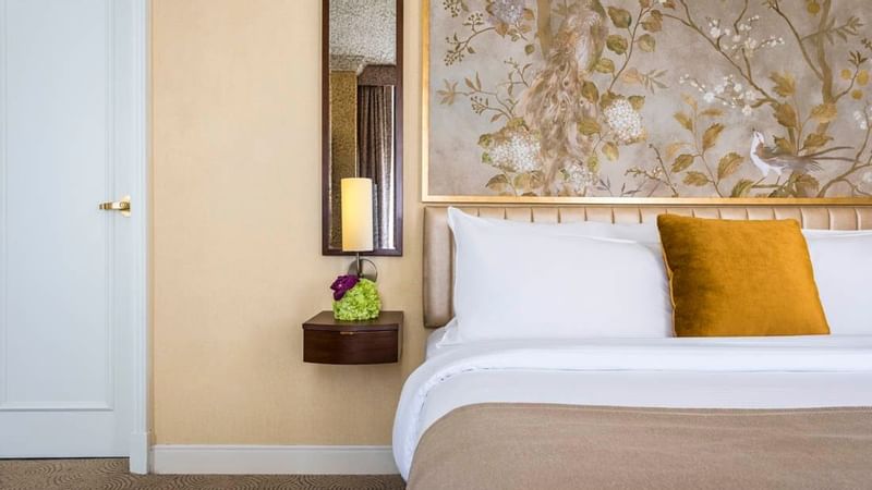 Bed & a wall table in Executive King Room at Warwick Allerton - Chicago