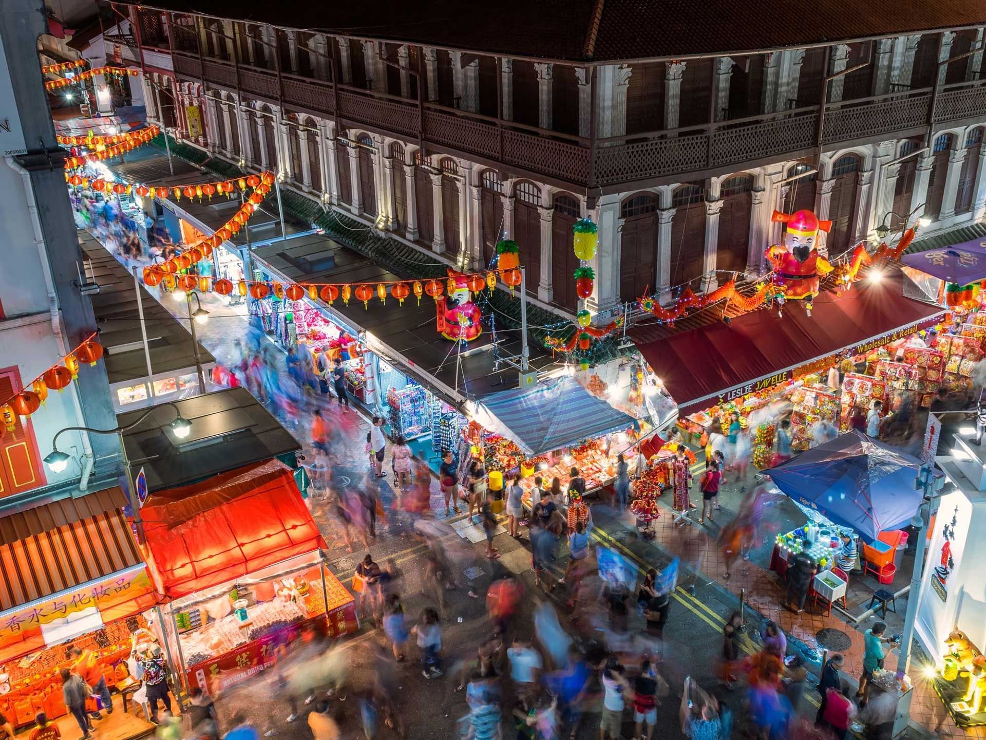 Aerial view of Chinatown at night with lanterns & decorations near Nostalgia Hotel Singapore