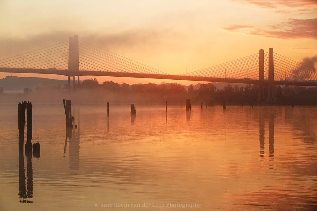 Bridge with sunset reflecting on water