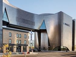 Exterior of Studio Bell, home of the National Music Centre near Acclaim Hotel Calgary