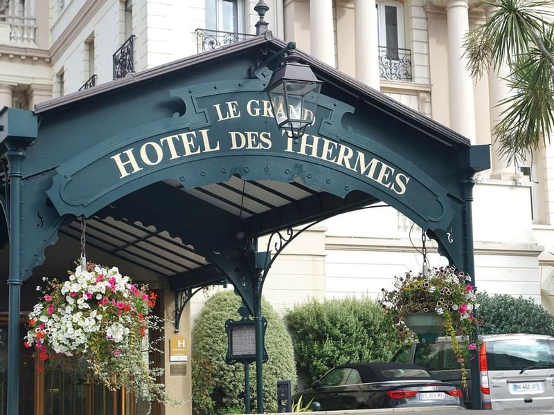 Entrance of Le Grand Hôtel des Thermes with flower deco
