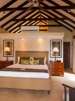 Buffet dining area featuring wooden furniture and large varse in Lagoon Terrace Restaurant at warwick le lagon vanuatu