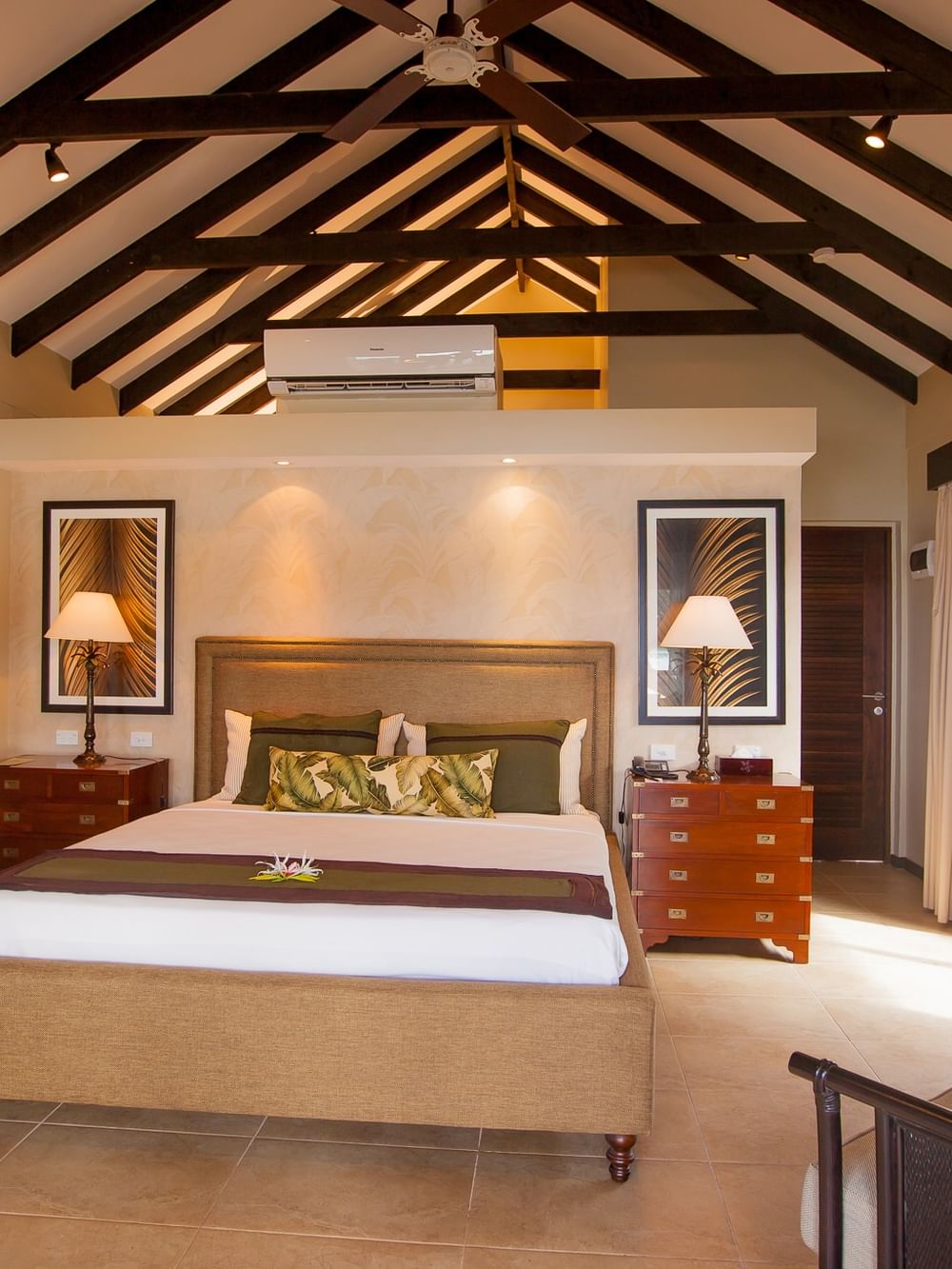 Buffet dining area featuring wooden furniture and large varse in Lagoon Terrace Restaurant at warwick le lagon vanuatu
