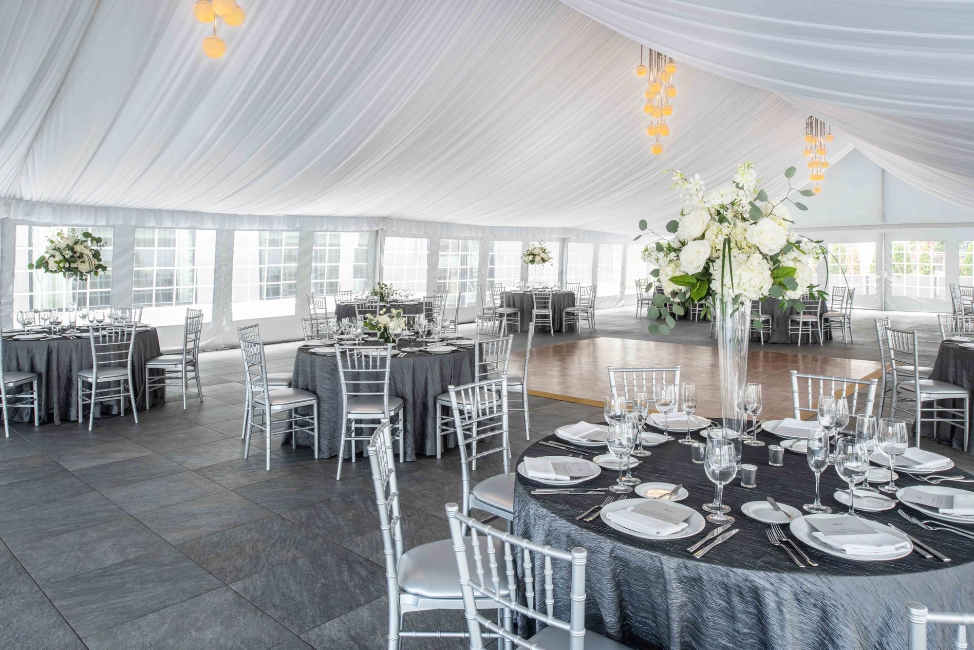 Outdoor event tent set for wedding reception