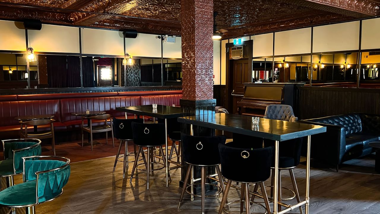 Dining tables arranged in a restaurant at Midnight Sun, a Coast Hotel