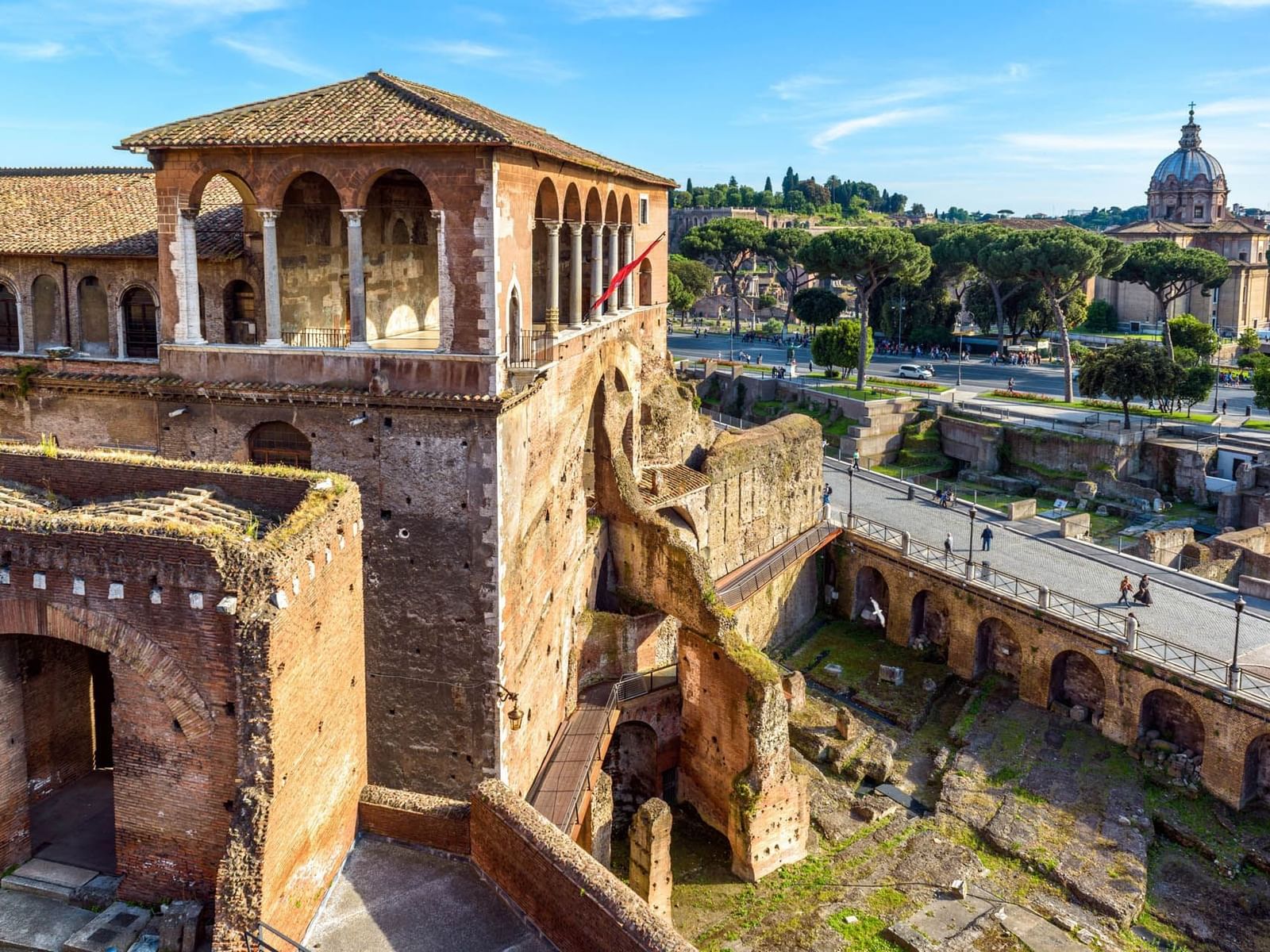 Aerial view of House of the Knights of Rhodes featuring arched structures and preserved walls near The Glam Hotel