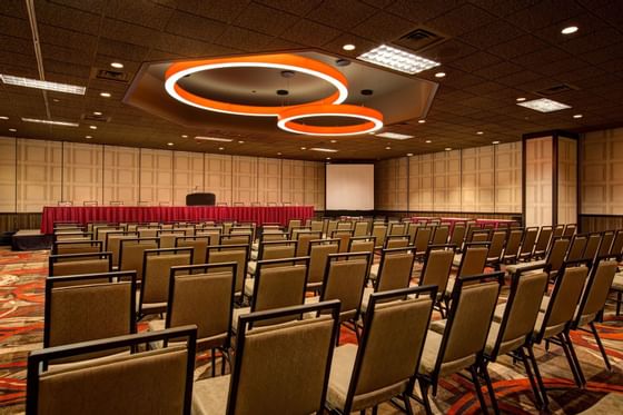 rows of chairs facing a projector screen
