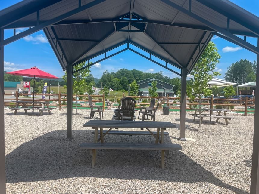 Outdoor shelter with benches & chairs near the Mini Golf Course at The Inn at Canaan