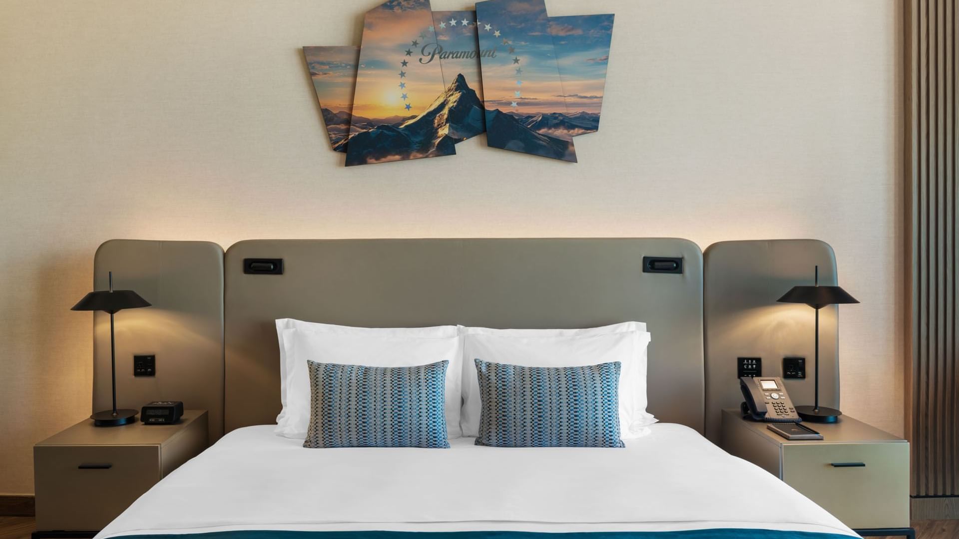 Nightstands and wall art by the bed in Scene Room at Paramount Hotel Midtown