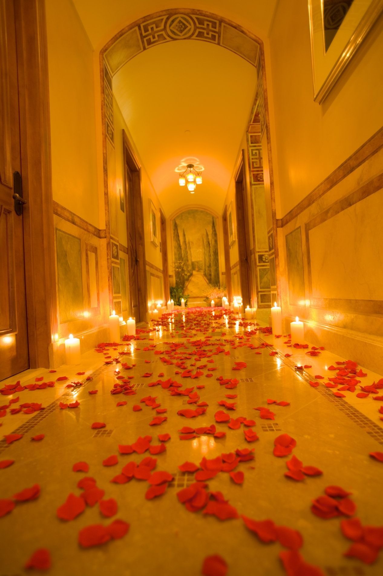 Hallway with candles and rose petals at Mission Inn Riverside