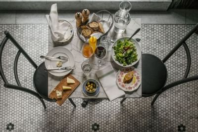 Breakfast dishes on a table in Wine Bar & Bistro at The Sparrow Hotel