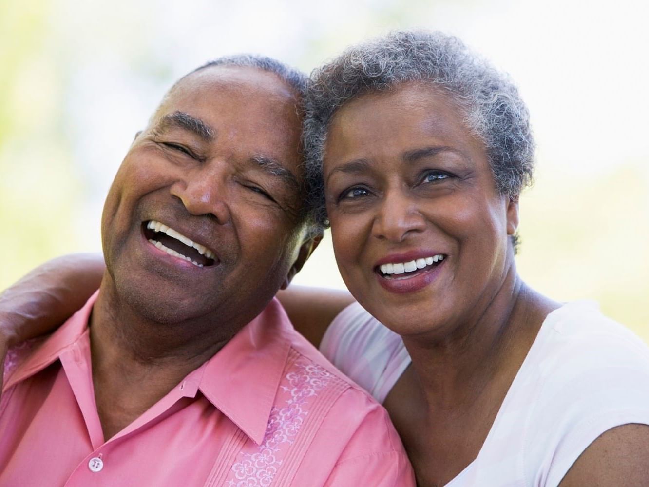 An older couple posing their smiles at Courtleigh Hotel & Suites