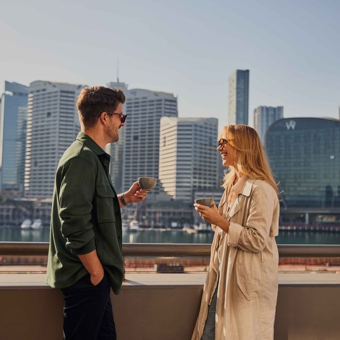 Couple enjoying sunset drinks on ibis bar deck