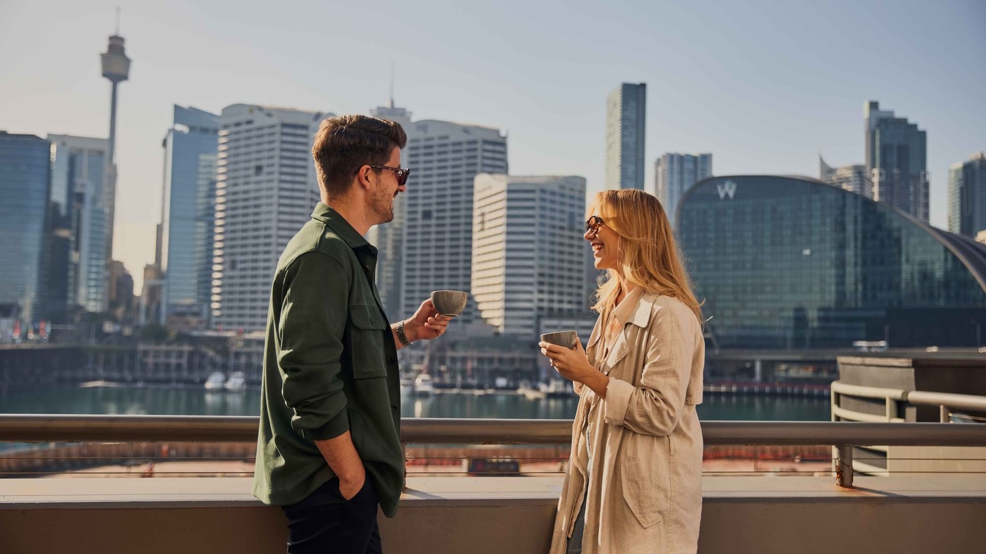 Couple enjoying sunset drinks on ibis bar deck