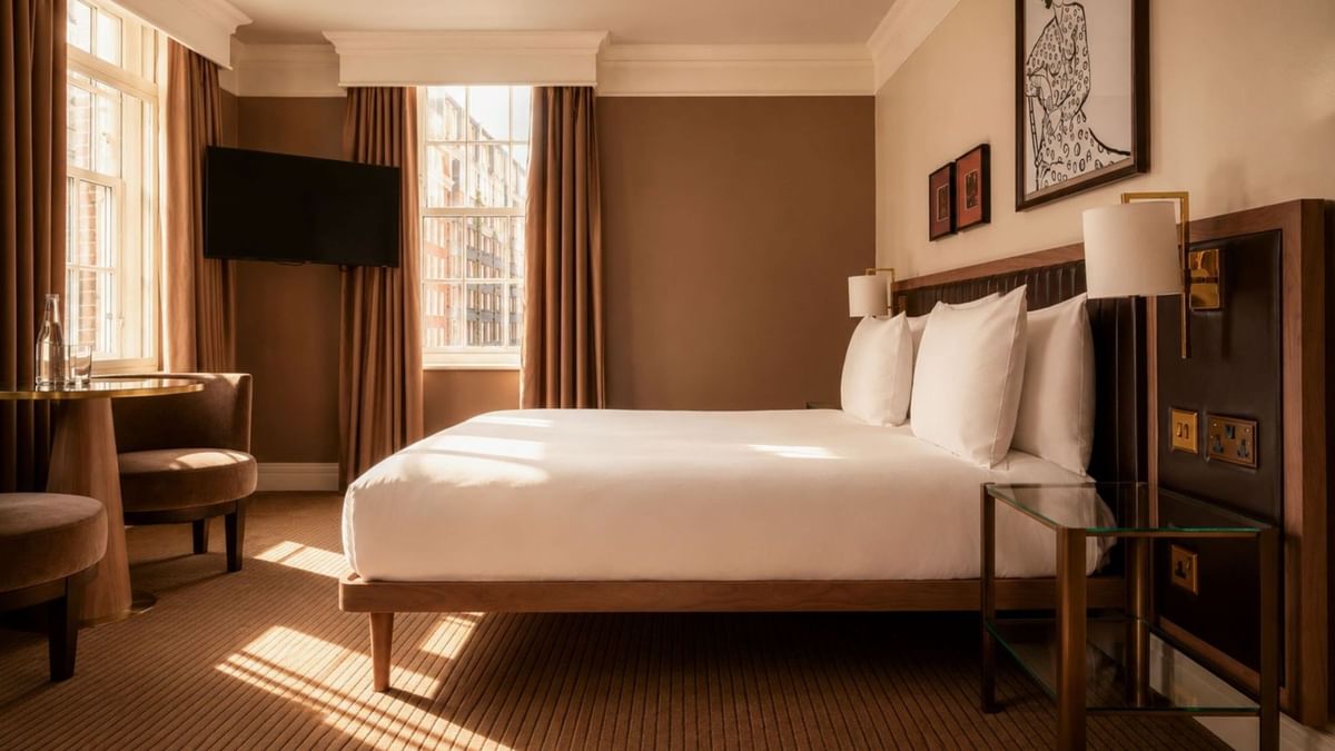 A luxurious Collection Deluxe Room at The May Fair Hotel in London