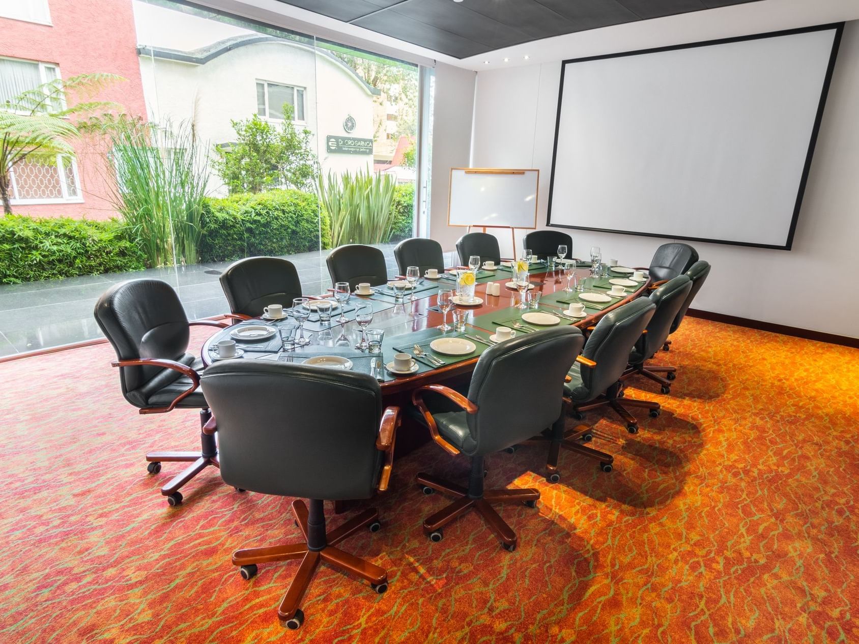 The arranged Dakota meeting room with black chairs and a table