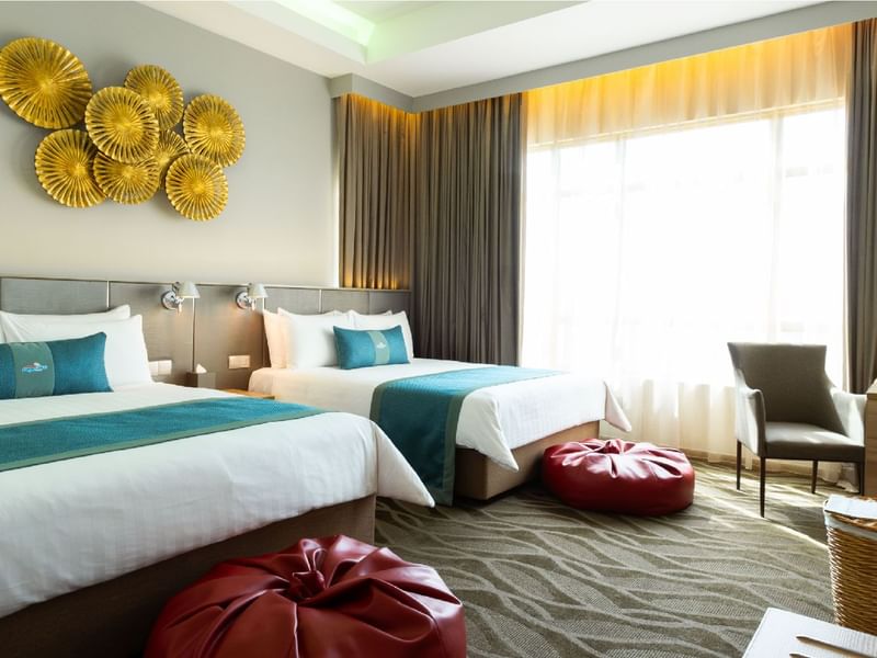 Bright, spacious family room with two comfortable beds and modern decor at Sunway Lagoon Hotel