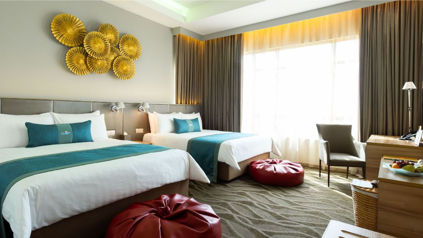 Bright, spacious family room with two comfortable beds and modern decor at Sunway Lagoon Hotel