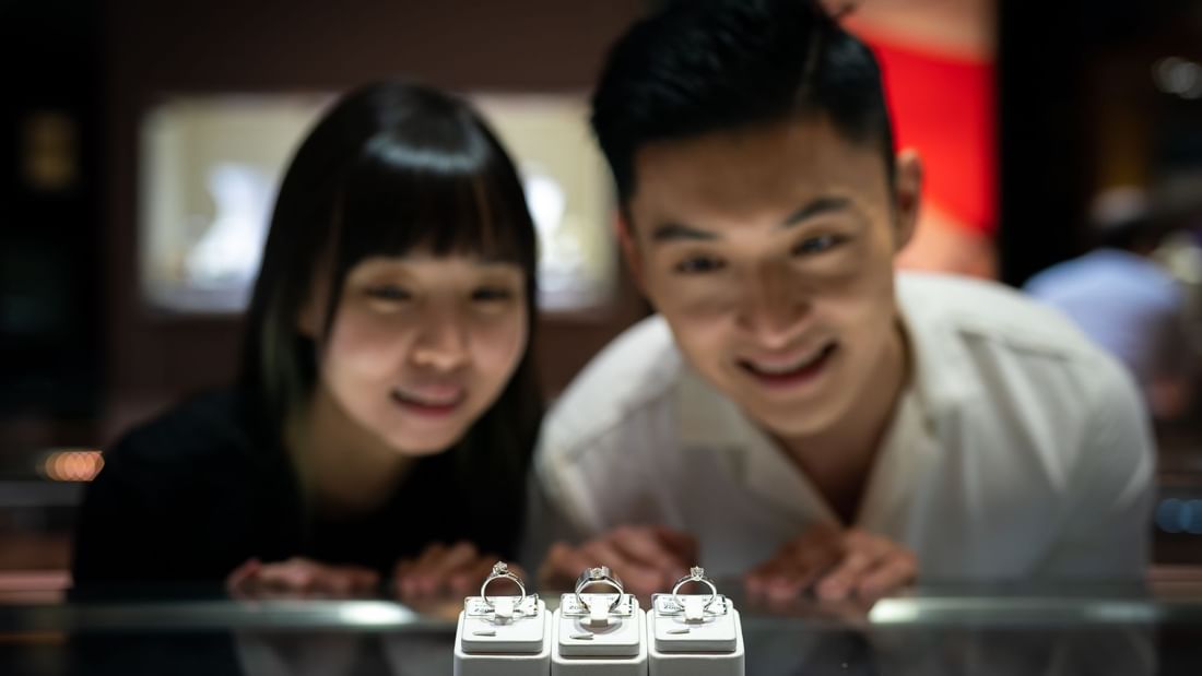 A couple gazing at rings in a shop near Sunway Resort