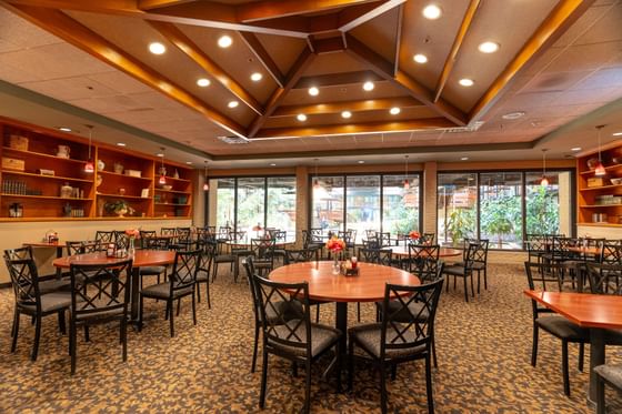 Dining tables arranged in Walden’s Restaurant at M Hotel Buffalo