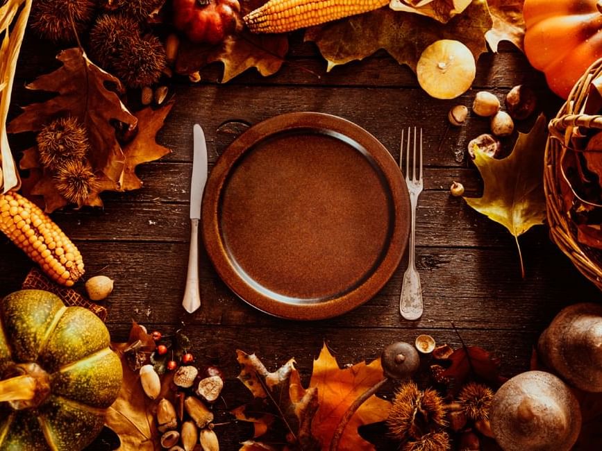 Thanksgiving dinner table with autumn leaves at Rosen Inn Lake Buena Vista