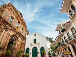 Few old buildings at the Old Town with palm trees