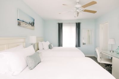 Spacious hotel room with two double beds