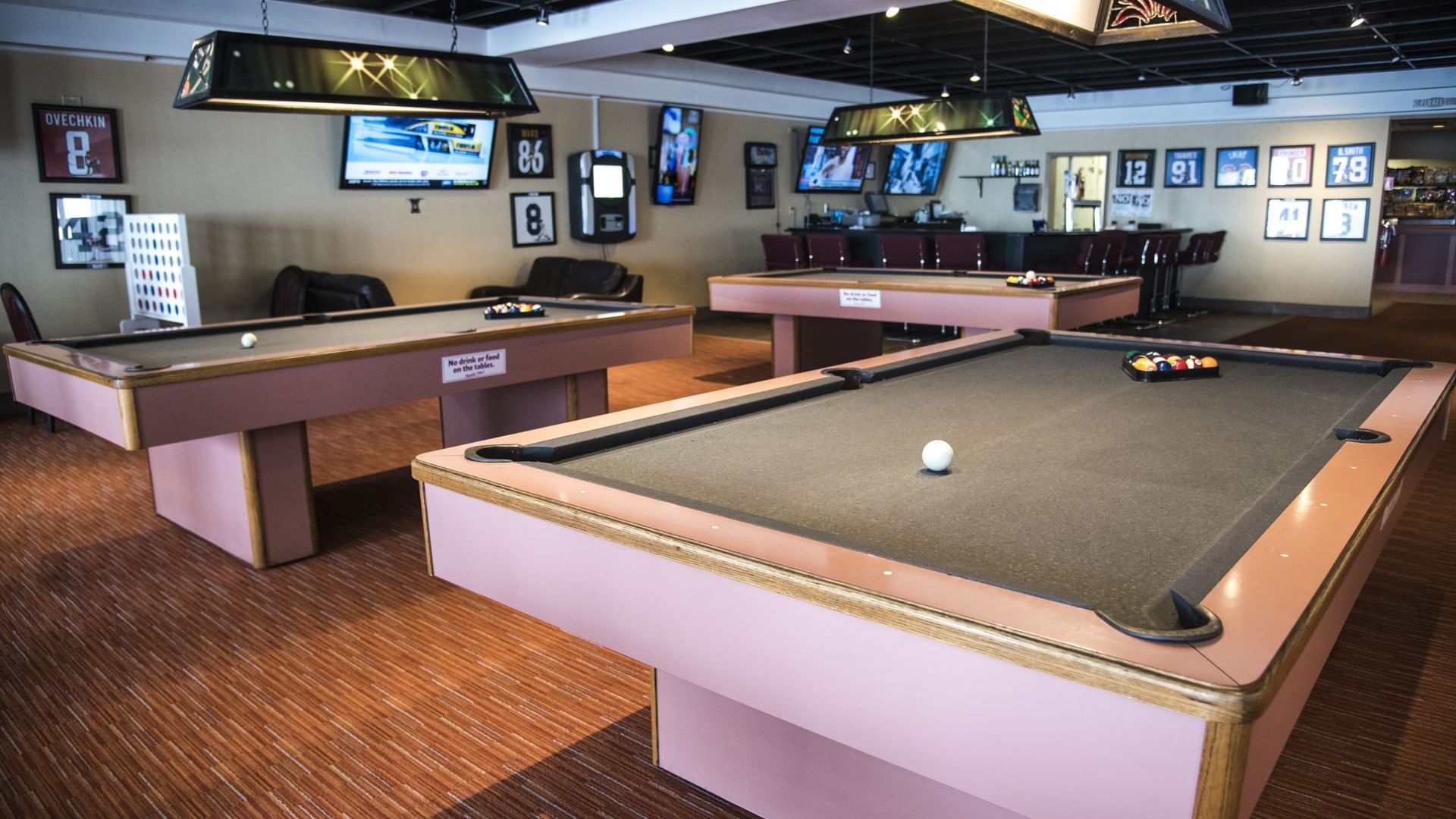Pool tables & dining area in Spooner's bar & grill at Cove Pocono