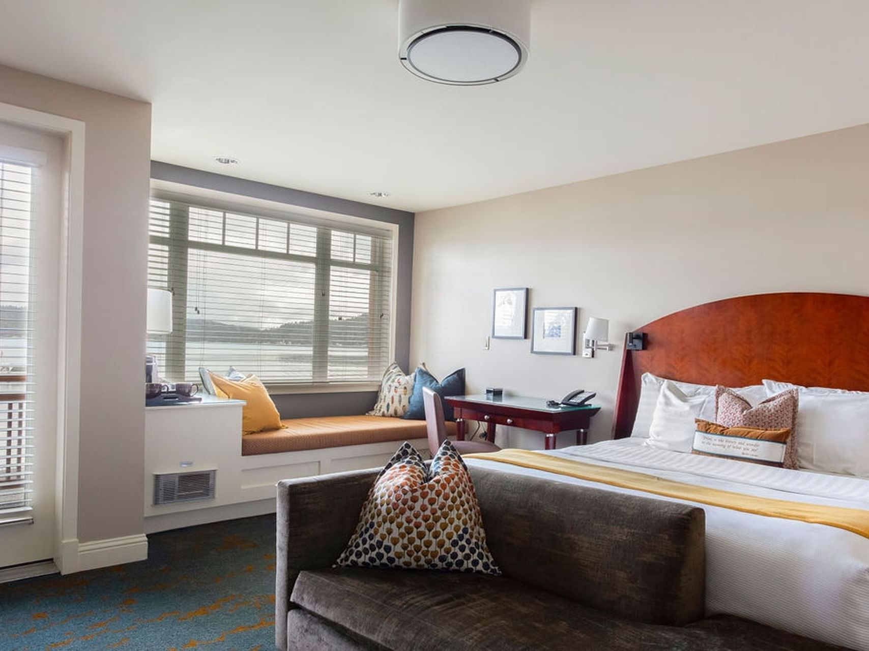 Window lounge area by the king-size bed in Waterfront King at Alderbrook Resort & Spa