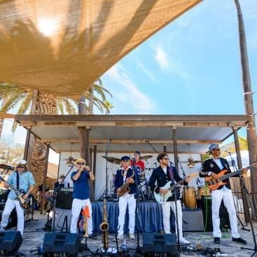 A band performing on an outdoor stage at Catalina Island Company