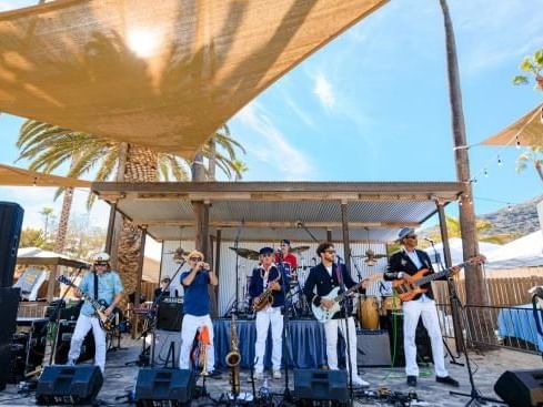 A band performing on an outdoor stage at Catalina Island Company
