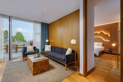 Separated living and bedroom areas with natural light in Terraces Presidential Suite at The Terraces Resort & Spa